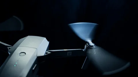Spinning drone propellers on black. Technologies for shooting from above Stock Footage 125897201
