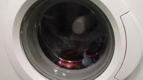 A spinning drum in a washing machine with laundry. Stock Footage 167806601