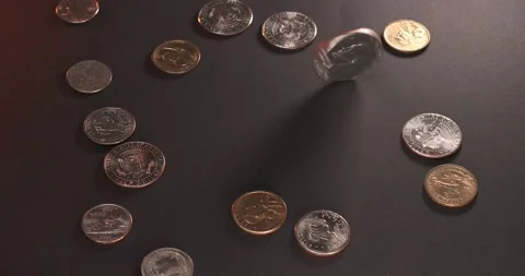 Spinning Eisenhower Dollar next to Dollar coins and Half Dollar coins Stock Footage 172116735