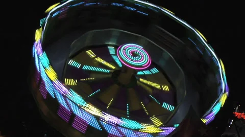 Spinning fair ground ride, medium shot, real time night. Stock Footage 27553283