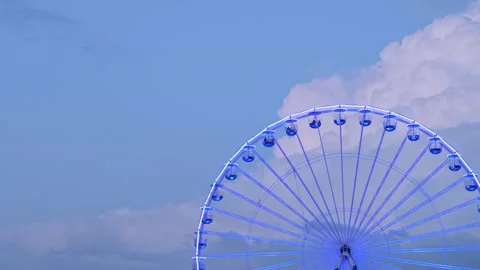 Spinning Ferris Wheel Structure with Glowing Lights Stock Footage 319826710