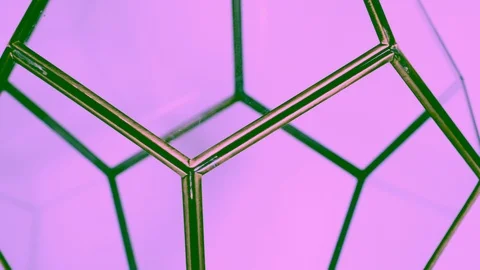 Spinning geometric shape on pink background Stock Footage 96547039