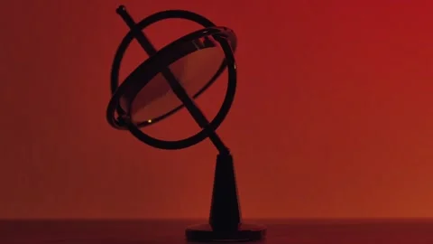 Spinning Gyroscope Balancing due to Gyroscopic Effect - Red Background Stock Footage 305538800