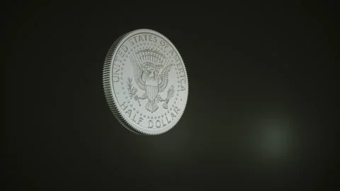 Spinning half dollar coin in slow motion Stock Footage 157750178