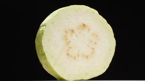 Spinning Half Guava Fruit 360 Loop Isolated on Black Background Stock Footage 319957367