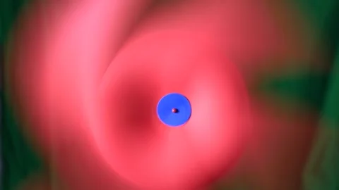 Spinning handmade red and blue paper pinwheel Stock Footage 247965092