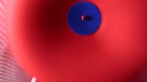 Spinning handmade red and blue paper pinwheel Stock Footage 248368231