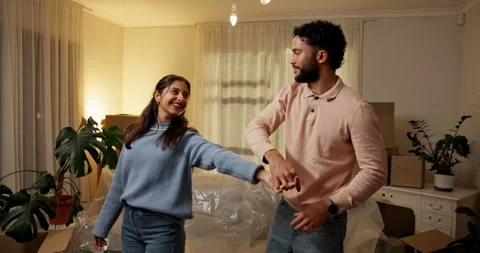 Spinning, happy and couple with dancing in new house for investment success Stockbeeldmateriaal 312375906