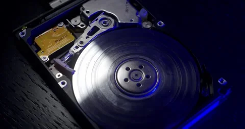Spinning up Hard Disk. Closeup of running storage device. Reading data on HDD Stock Footage 132078900