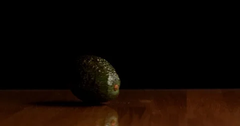 Spinning Hass avocado on table isolated Video stock 126258591