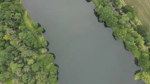 A spinning high angle shot over a river in a countryside. Stock Footage 280197071
