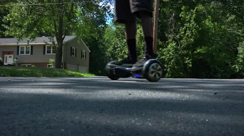 Spinning on hoverboard Stock Footage 64777592