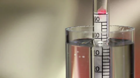 Spinning hydrometer measuring alcohol content Stock Footage 24827670