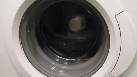 Spinning the laundry in the washing machine. Stock Footage 167806616