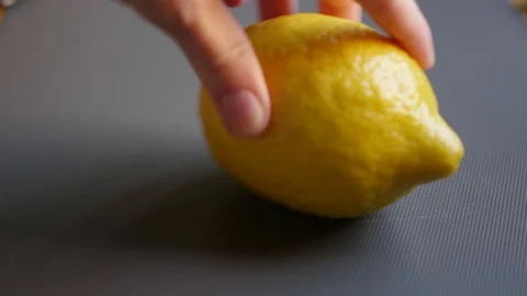 Spinning lemon on a grey backgound Stock Footage 88771331