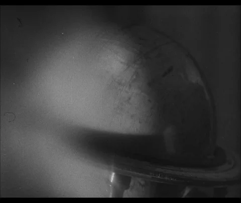 Spinning library globe and old maps, 1946, UK Stock Footage 130673814