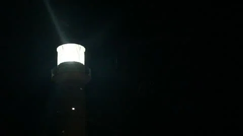 Spinning lighthouse at night Stock Footage 12426776