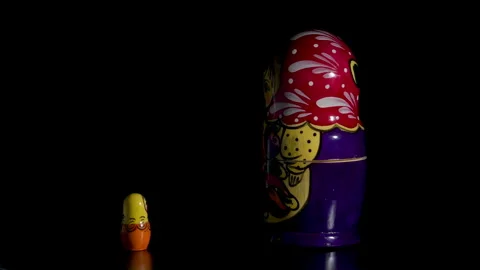 Spinning Matryoshka dolls on black background Stock Footage 342056426