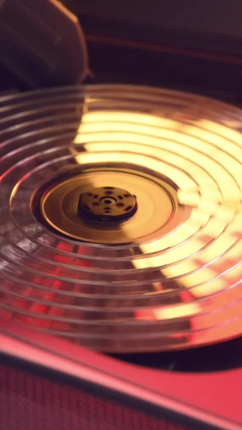 Spinning mirror CD in retro 90s player casts warm reflections, blending Video stock 305574130