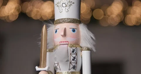 Spinning Nutcracker in a white uniform with a sword, representing the Christmas Stock Footage 287176842