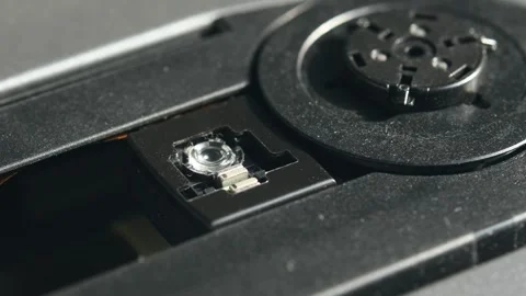 Spinning optical disc and exposed laser lens during active drive operation Stock Footage 305573757