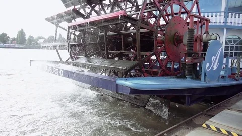 Spinning paddle wheel on back side of boat Stock Footage 71821158