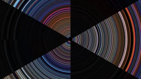 Spinning patterns create vibrant visuals in dark background Stock Footage 339453838