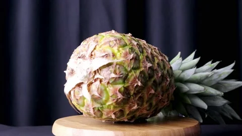 Spinning pineapple on turntable Stock-Footage 184628937