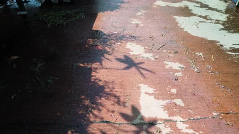 Spinning Pinwheels shadow on the ground. Stock Footage 137873965