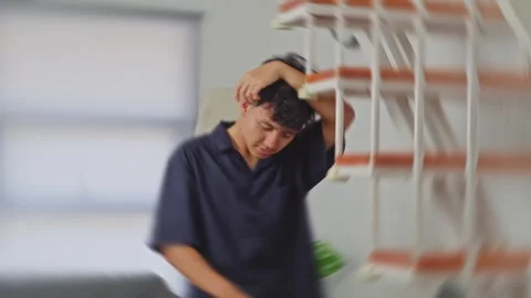Spinning POV of dizzy young man stumbling experiencing severe vertigo or Stock Footage 335484540