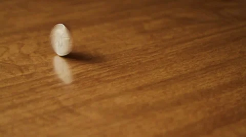 Spinning Quarter Stock Footage 35114035