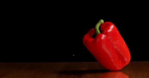 Spinning red paprika on table isolated Видео 126258632