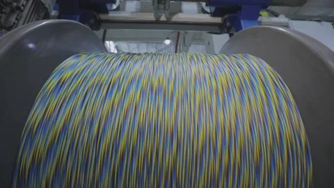 Spinning reel with cable close-up. Large reel with cable in production Видео 152615872