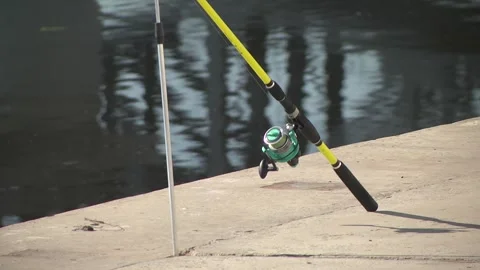 Spinning with a reel close-up on the background of the river Stock Footage 252484473