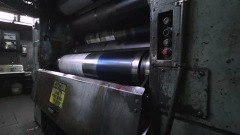 Spinning rollers at a newspaper printing press Stock Footage 130799691