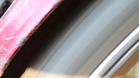 Spinning rotating fast moving cycle bike tyre tube wheel motion blur pattern Stock Footage 142151762