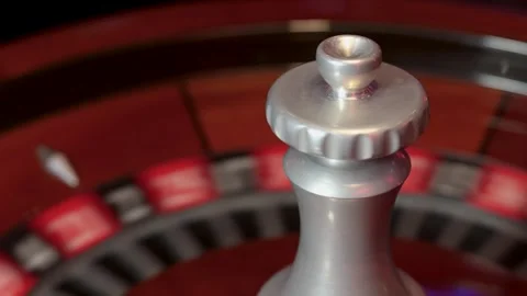 Spinning roulette wheel with central spindle and moving ball Stock Footage 336406367