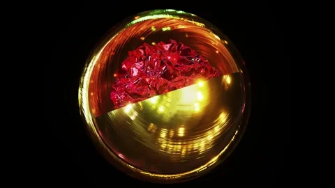 Spinning shining ruby or red crystal inside of two gold hemispheres Stock Footage 270079458