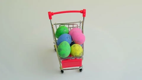 Spinning shopping trolley with Easter eggs Stock Footage 170678680