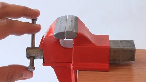 Spinning small bench  red vise Stock Footage 97920938