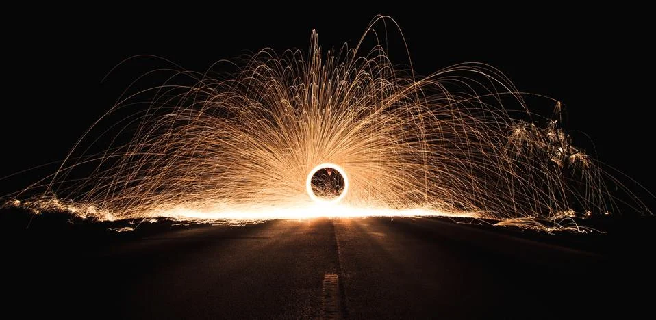 A spinning sparking force circle in a large dark room Stock Photos