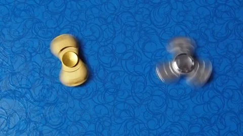 Spinning spinners on a blue background. Stock Footage