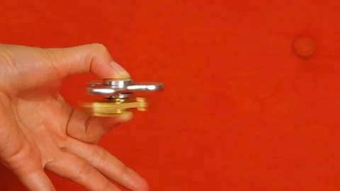 Spinning spinners close-up in a female hand. Stock Footage