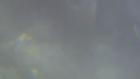 Spinning split holographic bokeh spots background Stock Footage 221787802