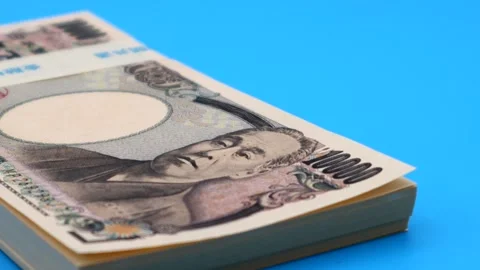 A spinning stack of old 10,000 yen bills Stock Footage 336541537