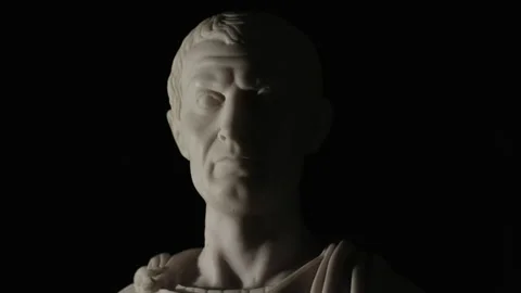 Spinning statue of Caesar on black background Stock Footage 144392887