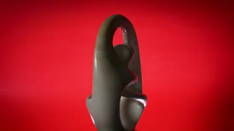 Spinning Statue of Couple Unity on Red Background Vídeo Stock 307679411