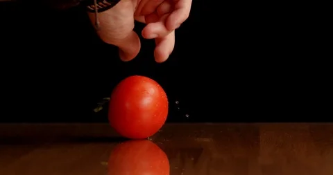 Spinning tomato on table isolated 스톡 동영상 126258593