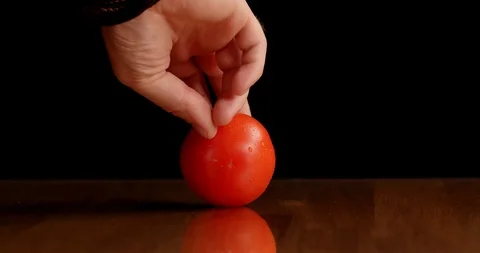 Spinning tomato on table isolated Stock Footage 126258594