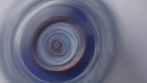 Spinning Top Creating Abstract Circular Patterns with Blue and Red Colors Stock Footage 330927008